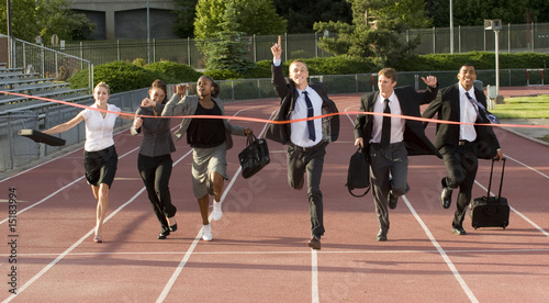 Business People Running Across the Finish Line