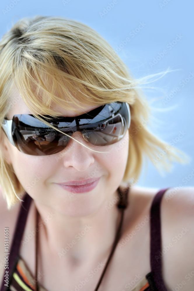 Attractive young woman wearing sunglasses Attractive young woman wearing sunglasses