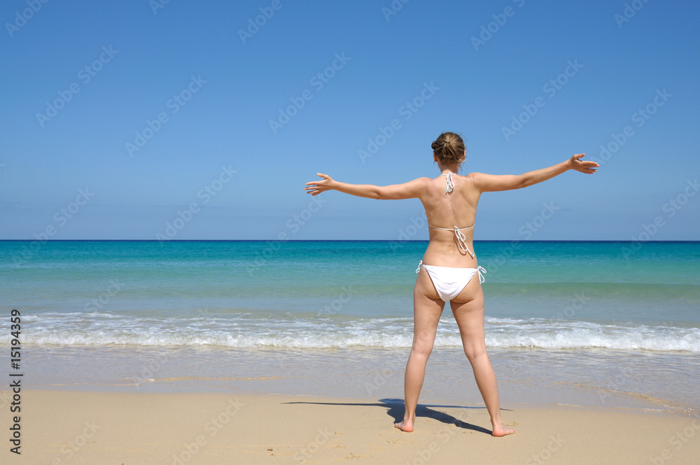 Young woman enjoying the beach, Fuerteventura Spain Young woman enjoying the beach, Fuerteventura Spain