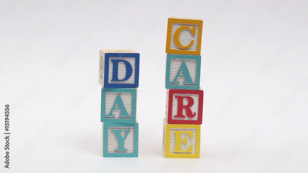 Wooden alphabet blocks spell out DAY CARE Wooden alphabet blocks spell out DAY CARE