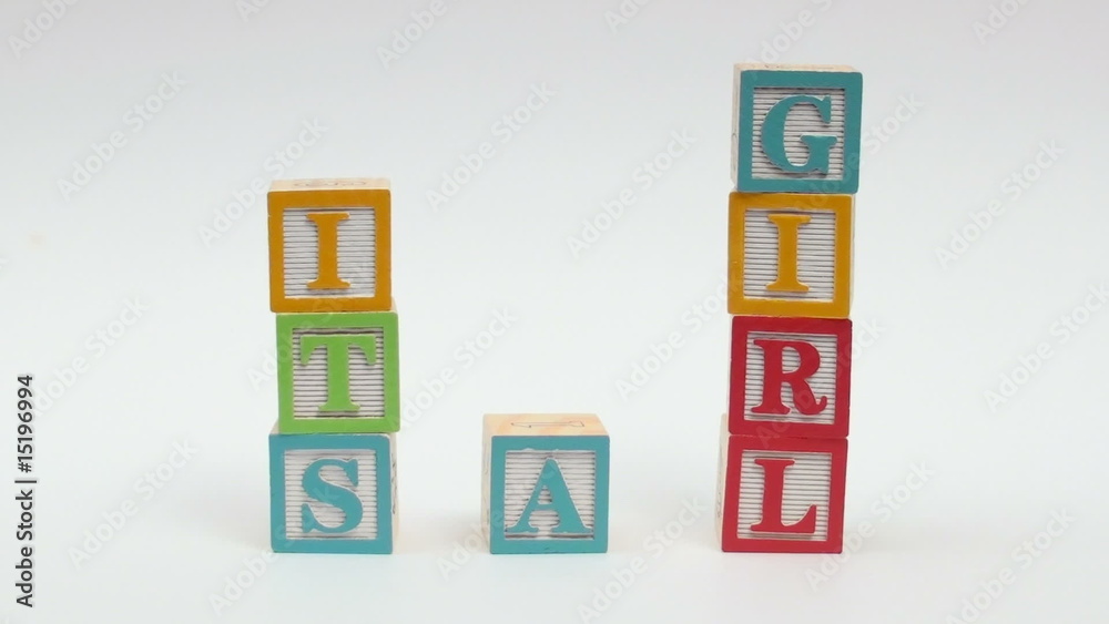Wooden alphabet blocks spell out IT'S A GIRL Wooden alphabet blocks spell out IT'S A GIRL
