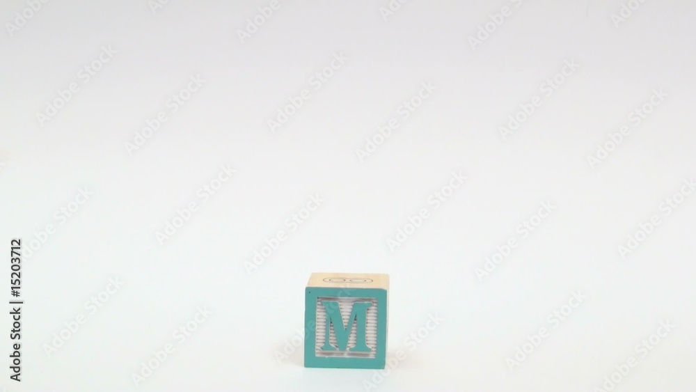 Wooden alphabet blocks spell out TEAM Wooden alphabet blocks spell out TEAM