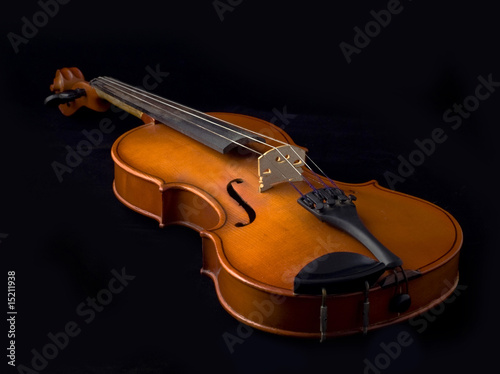 Antique violin over black