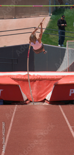 Girl pole vaulting