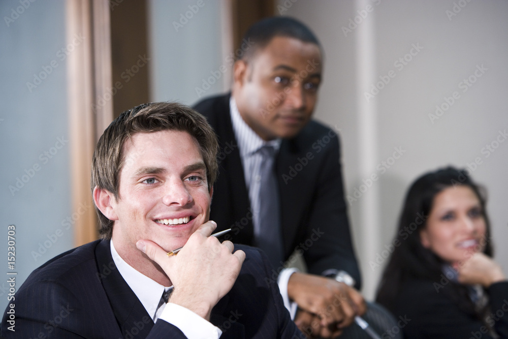 Multi-ethnic business executives meeting in boardroom Multi-ethnic business executives meeting in boardroom