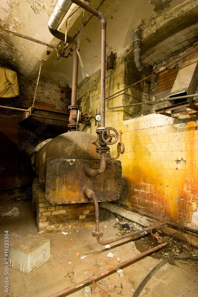 Old boiler and rusted wall.