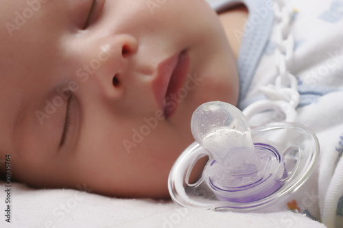 sleeping baby with dummy