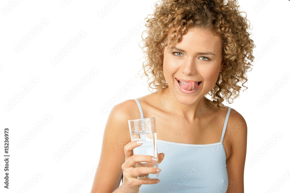 Young woman with glass of water licking lips Young woman with glass of water licking lips