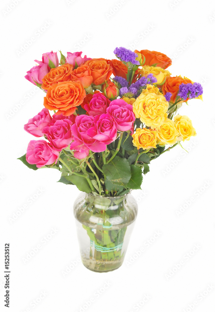Color roses bouquet in glass vase.