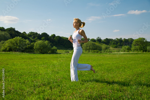 Beautiful young woman running outdoors