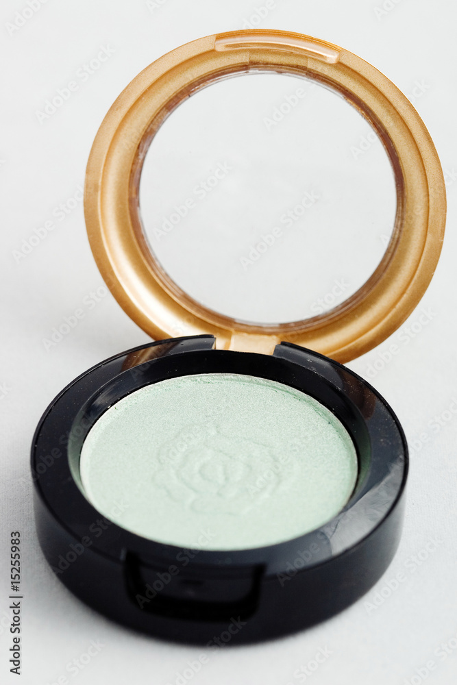 Isolated light green eyeshadow on white background Isolated light green eyeshadow on white background