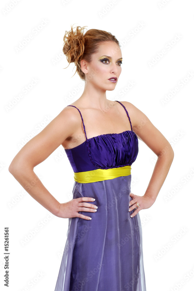 woman wearing a purple dress with hands on her hip woman wearing a purple dress with hands on her hip