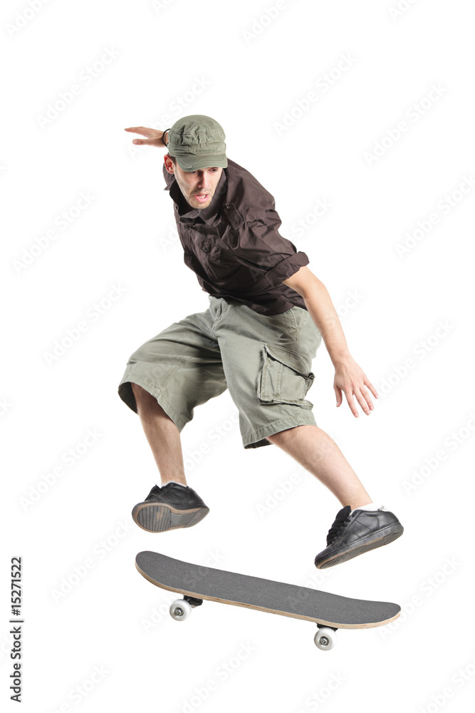 A skateboarder jumping isolated on a white background A skateboarder jumping isolated on a white background