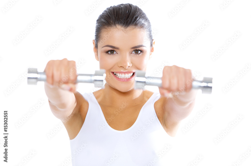 Young beautiful woman during fitness time with dumbbells