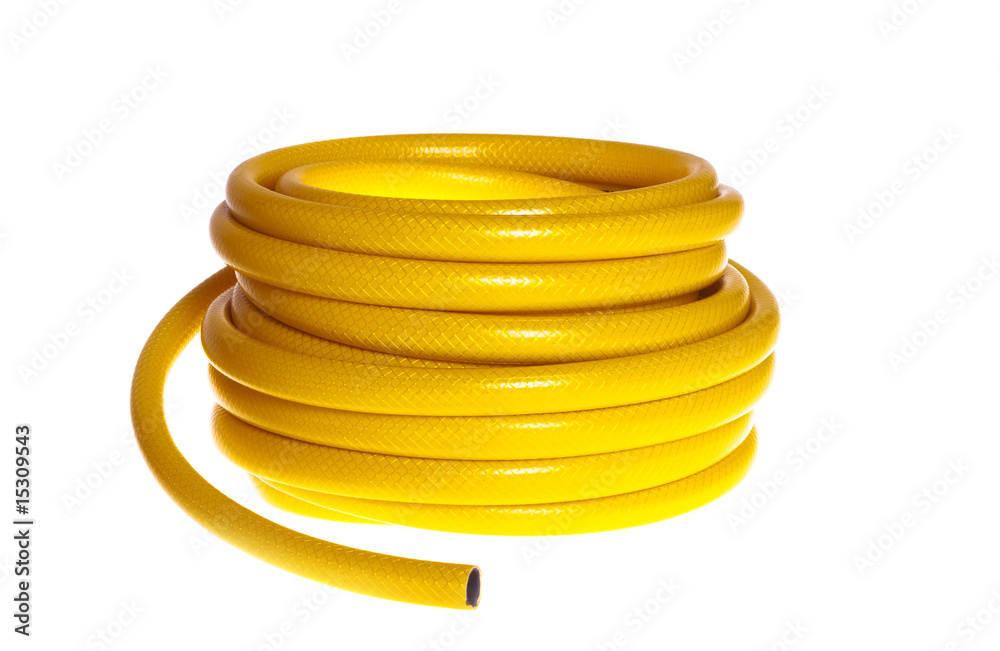 The yellow rubber garden hose on a white background (isolated). The yellow rubber garden hose on a white background (isolated).