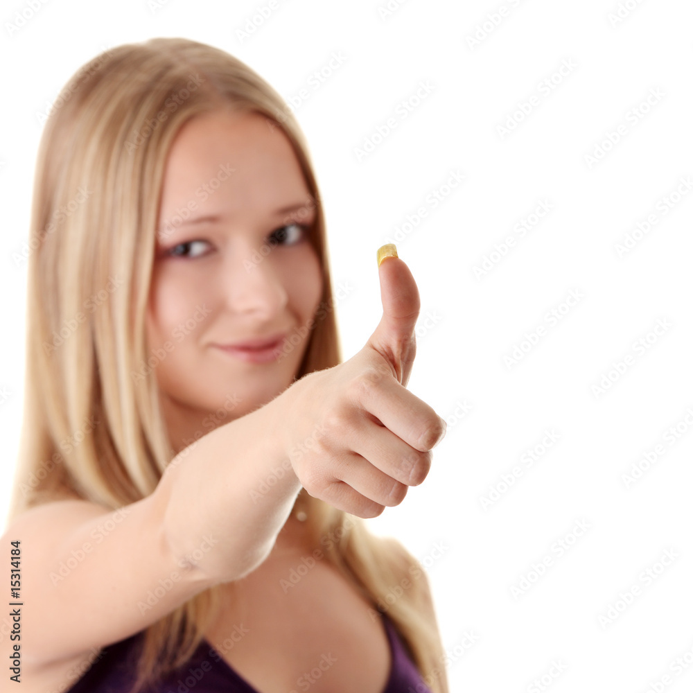 Casual woman smiling with her thumbs up - isolated Casual woman smiling with her thumbs up - isolated