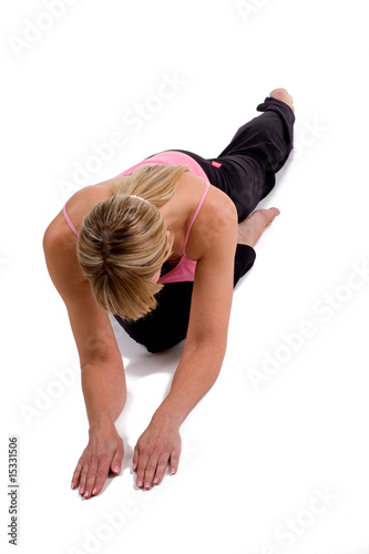 Woman doing yoga on white background