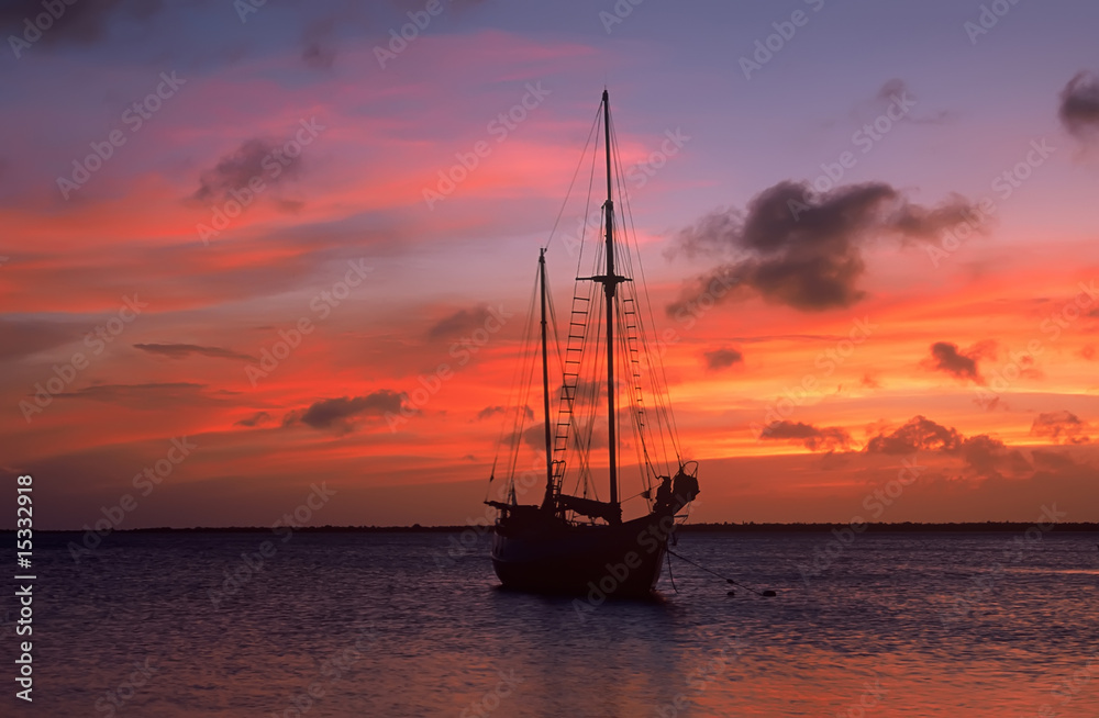 Caribbean sunset with sailboat silhouette, Bonaire