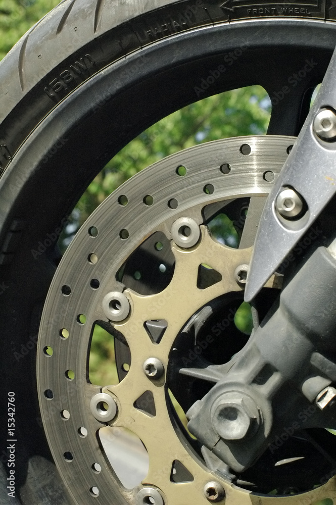 motorcycle brake disc and tire close-up