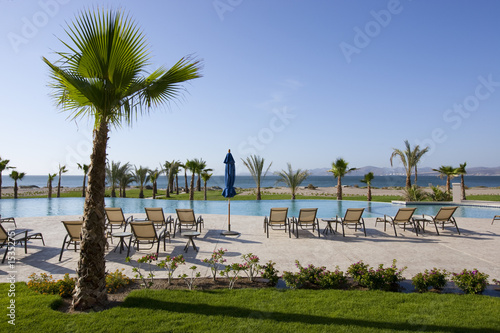 Resort Pool and Chair with Sea View