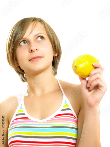 Pretty lady with a fresh lemon