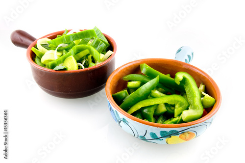 Two bowls with fresh vegetables isolated on white background