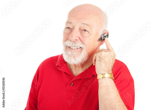 Senior Man Using Hands Free Set