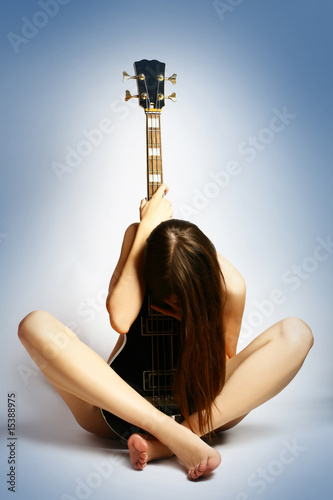 denuded girl with guitar