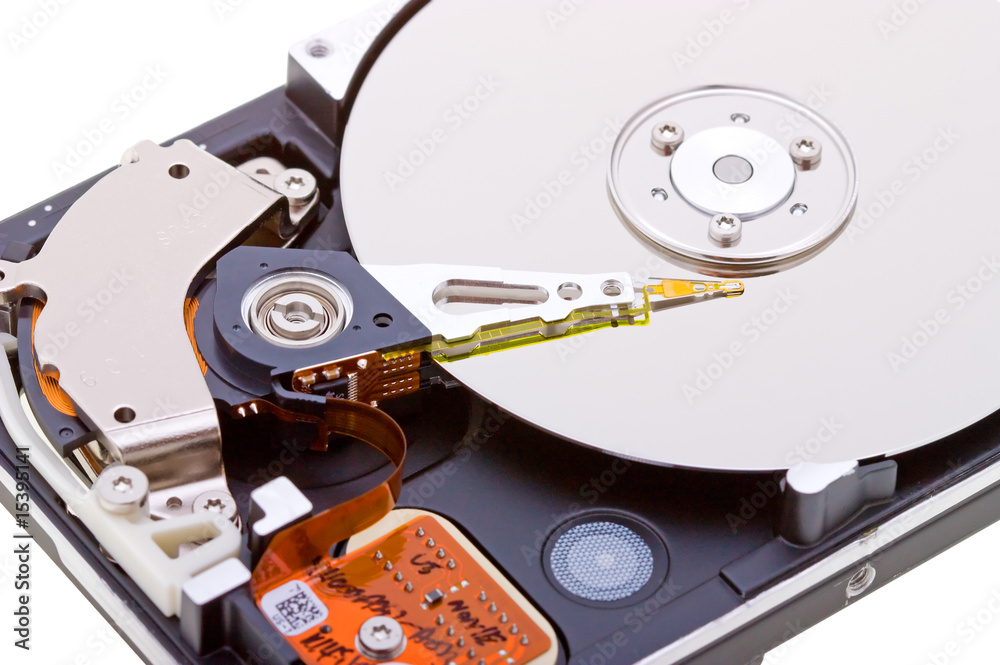 Close-up inside view of hard disk isolated on white Close-up inside view of hard disk isolated on white