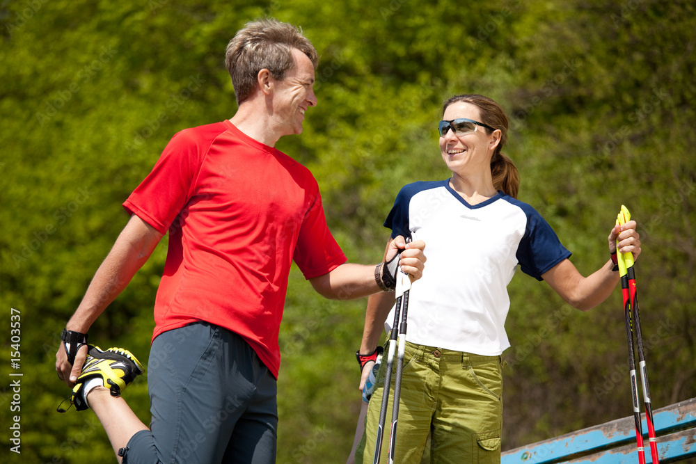 Fototapeta premium happy couple stretching quadriceps