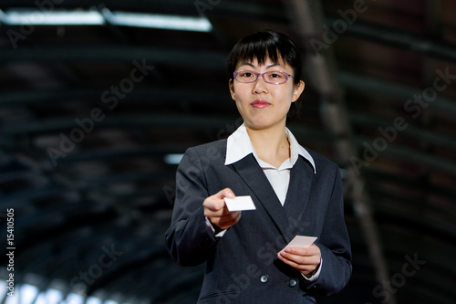 Asian business woman with calling card