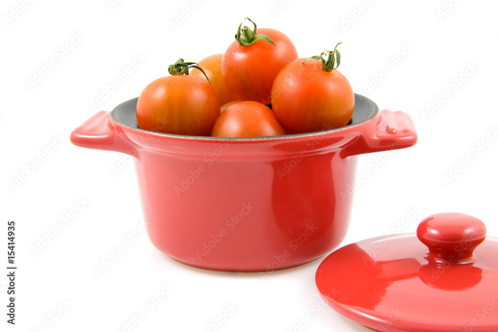 red casserole with cherry tomatoes red casserole with cherry tomatoes