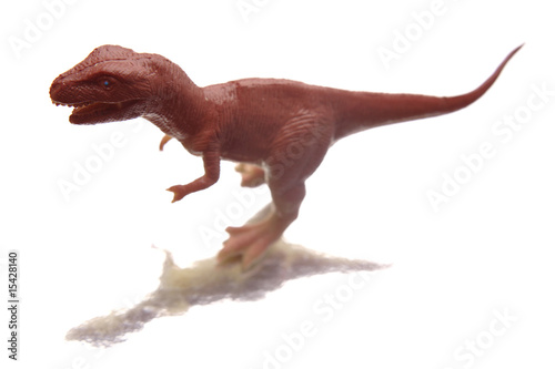 Plastic dinosaur isolated over white background