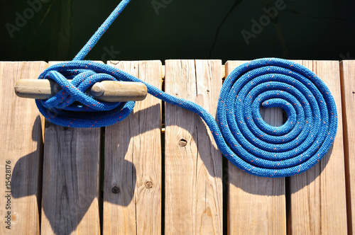 Fotografija Coiled Blue Rope and Cleat