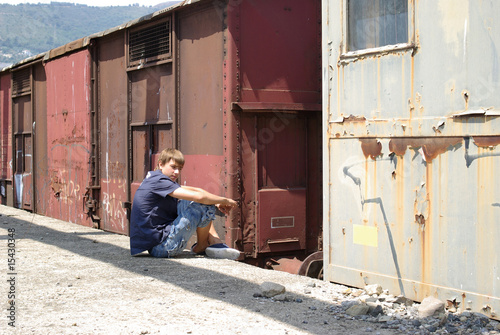 Boy in abandoned train station