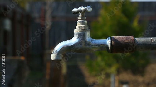 Water dripping from an old garden tap