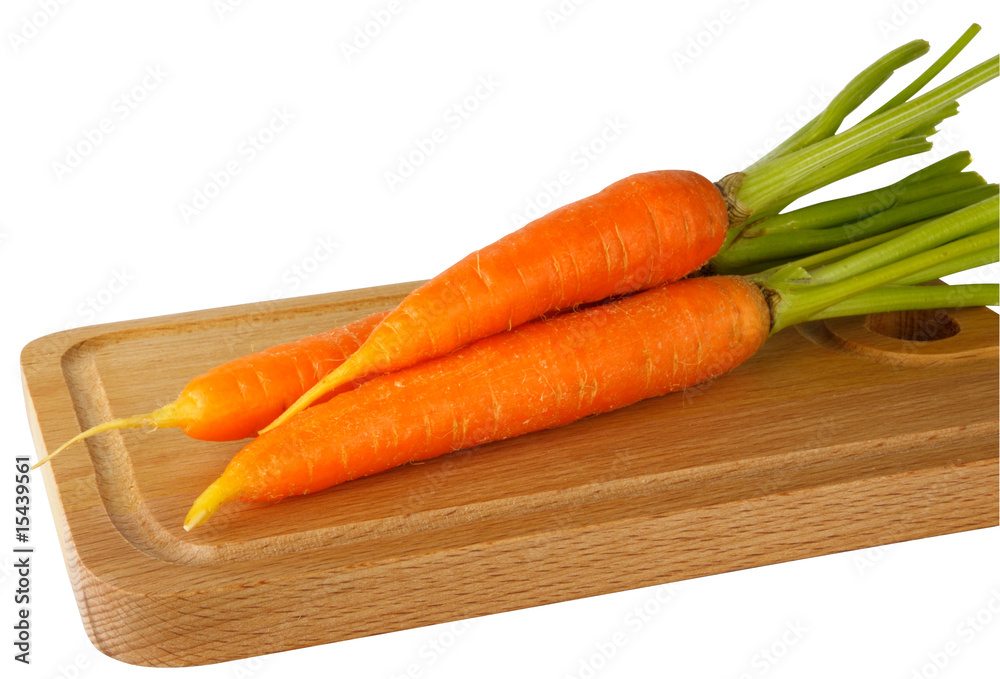 Fresh carrots on the chopping board Fresh carrots on the chopping board