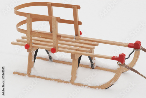 wooden child  sledge  on the snow