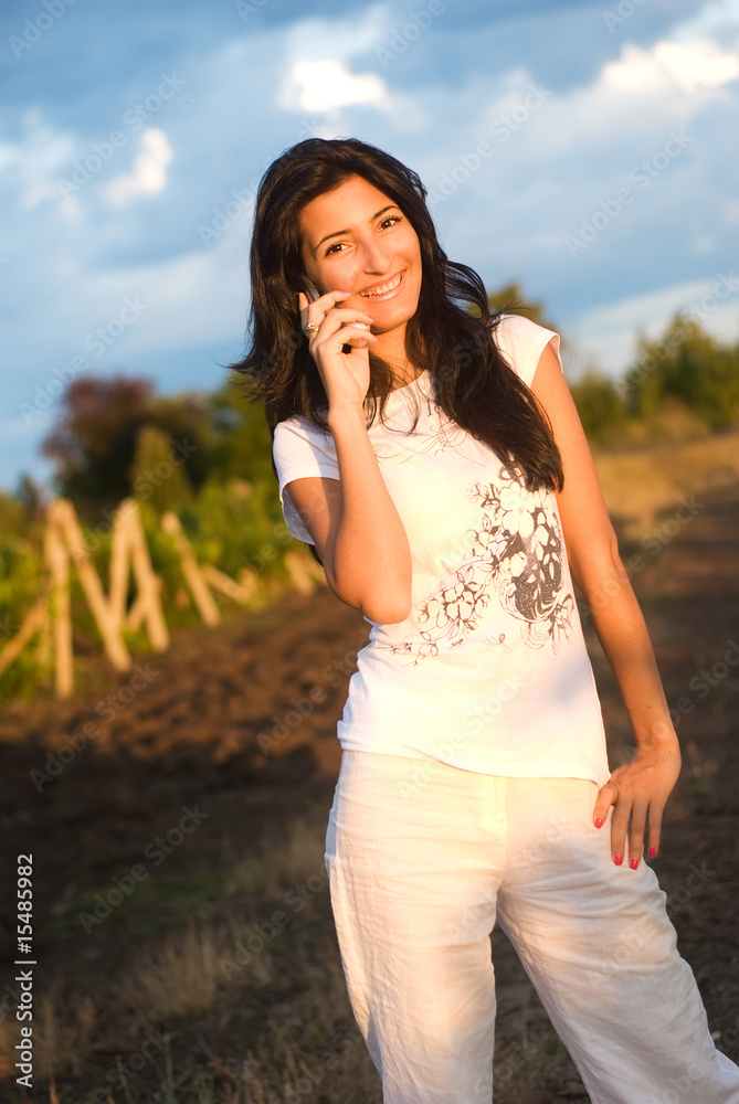 Girl,phone and vineyard