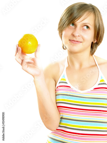 Smiling young lady holding a fresh orange
