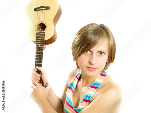 Angry girl fighting with a guitar
