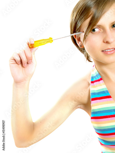 Pretty young lady thinking with a screwdriver