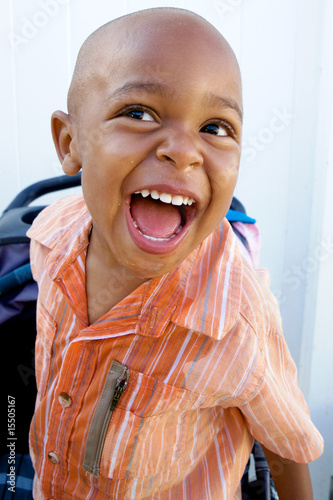 A Handsome little African American Boy smiling for the camera