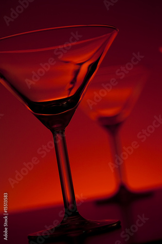 martini glasses over red background