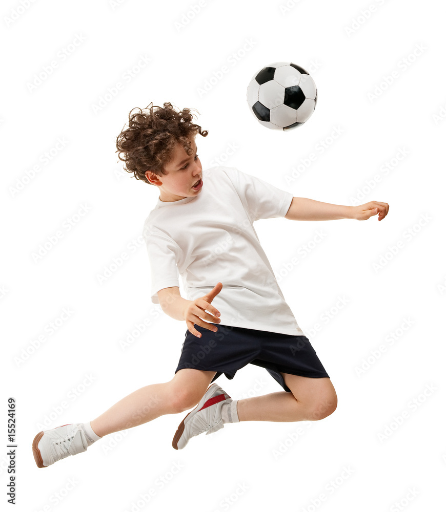 Fototapeta premium Boy playing football isolated on white background