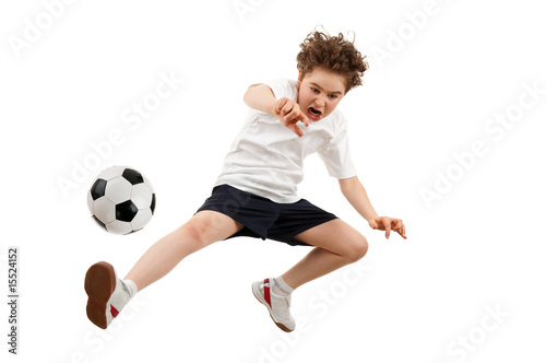 Boy playing football isolated on white background