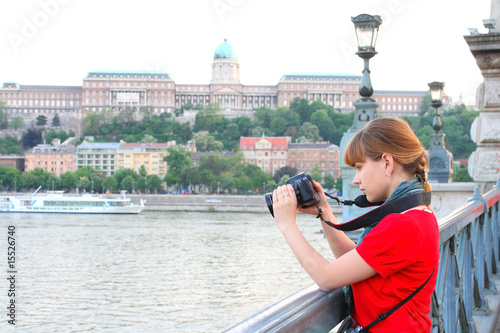 Girl watchingat the shoot in the DSLR camera
