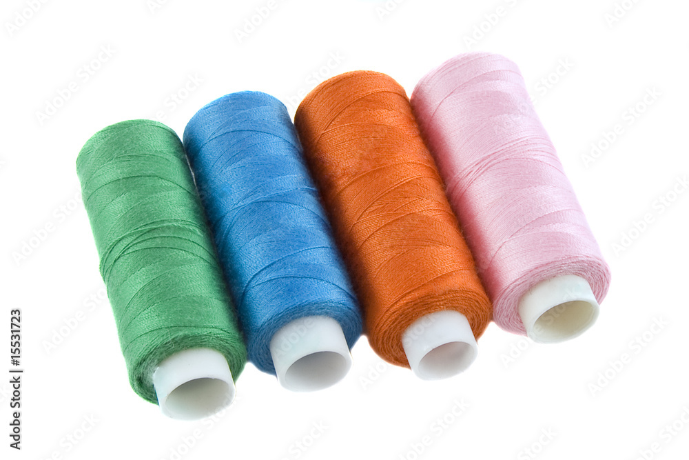 Many colorful threads over the white background Many colorful threads over the white background