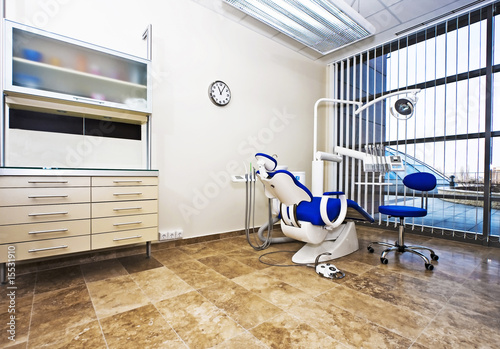 Modern dentist's chair in a medical room.