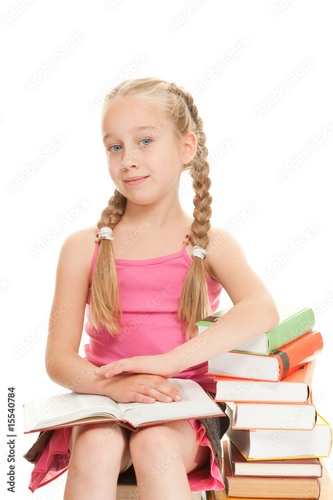 Little schoolgirl sitting on a stack of books.... Little schoolgirl sitting on a stack of books....